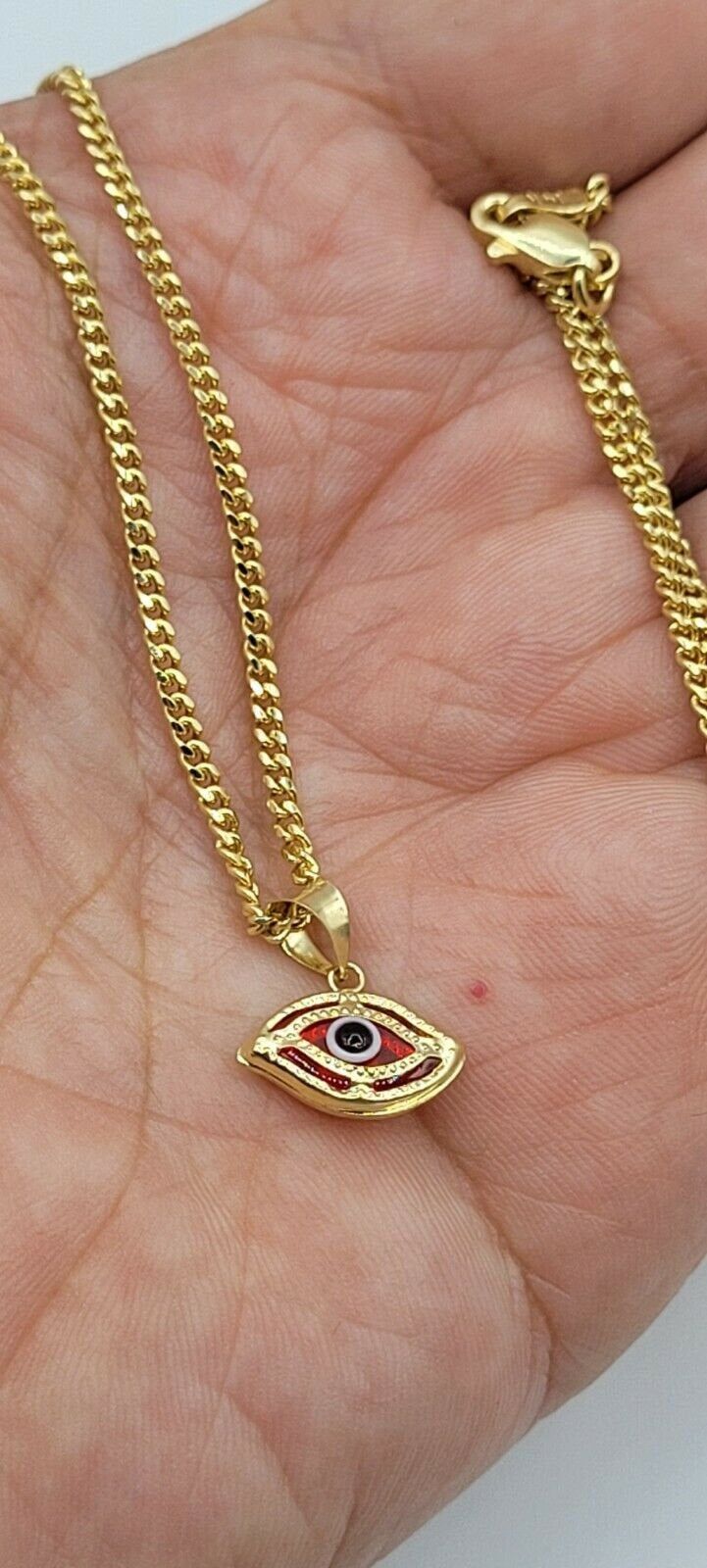 "14K GOLD RED EVIL EYE NECKLACE 20\"/14K ORO PURO CADENA DE OJO DE LA SUERTE-6.4GR. Shipped with USPS First Class. 14 K SOLID GOLD RED EVIL EYE NECKLACE .20\"LONG FIGARO CHAIN. REAL 14K GOLD (NOT PLATED OR FILLED).-- 6.4 GR--FOR GOOD LUCK AND PROTECTION PENDANT SIZE : 13 mm X 13 mm ---MADE IN ITALY-BEST QUALITY--- FREE GIFT BOX NOTE:THIS ITEM IS SHIPPED WITH SIGNATURE CONFIRMATION. CADENA DE OJO DE LA BUENA SUERTE EN ORO PURO 14K. 20\" LARGO FIGARO CADENA. COLOR ROJO .--6.4 GR-- PARA BUENA SUERT Luxury Red Necklace For Gift, Luxury 14k Gold Red Necklace, Luxury Red 14k Gold Necklace, Red 14k Gold Polished Jewelry, Red 14k Gold Jewelry With Polished Finish, Luxury Red Pendant Jewelry, Red Tarnish Resistant Necklace As Gift, Red Tarnish Resistant Necklace For Gift, Luxury Handmade Red Jewelry