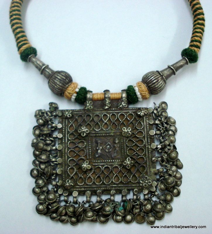 "VINTAGE ANTIQUE COLLECTIBLE TRIBAL OLD SILVER PENDANT NECKLACE FROM RAJASTHAN INDIA. NICE DESIGN OLD SILVER PENDANT RE-STRUNG WITH COTTON CORD & OLD SILVER BEADS IN TRADITIONAL STYLE. GREAT PIECE FOR ETHNIC JEWELRY COLLECTOR OR FOR TRIBAL STYLE BELLY DANCE. SUBJECT OF THIS AMULET IS HINDU GODDESS LAXMI (GODDES OF WELTH) AND LORD GANESHA (GOD OF MIND AND LUCK). Note - bells make good sound. Length - 46 cm(18.1\")we can adjust the length. Pendant size - 9/6.6 cm(3.54/2.6\") Weight - 133 grams Luxury Oxidized Amulet Necklaces, Luxury Silver Amulet Beaded Necklaces, Antique Locket Necklace For Festivals, Traditional Handmade Antique Silver Necklace, Heavy Antique Pendant Necklace, Bohemian Antique Silver Necklace For Ceremonial Occasions, Vintage Silver Beaded Pendant Necklace, Vintage Silver Beaded Necklaces For Festive Occasions, Vintage Silver Beaded Necklace For Festive Occasions