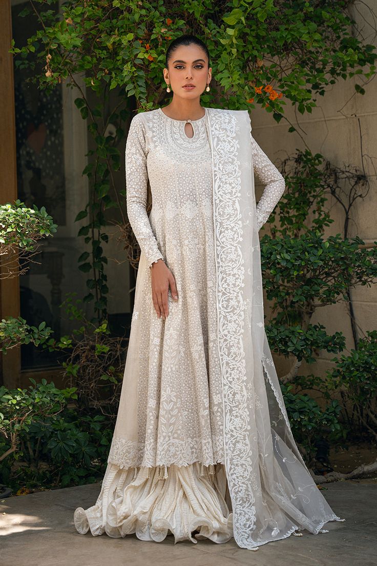 Sherine Off White Raw Silk Salwar Kameez With Sheer Dupatta, Cream Salwar Kameez With Sheer Dupatta For Reception, Beige Chikankari Embroidery Anarkali Set For Reception, Transitional Raw Silk White Anarkali Set, Transitional White Raw Silk Anarkali Set, White Dupatta For Reception And Transitional Season, Anarkali Off White Dupatta With Resham Embroidery, Reception Anarkali Set With Naqshi In Chinon, Reception Anarkali Set With Naqshi Detailing