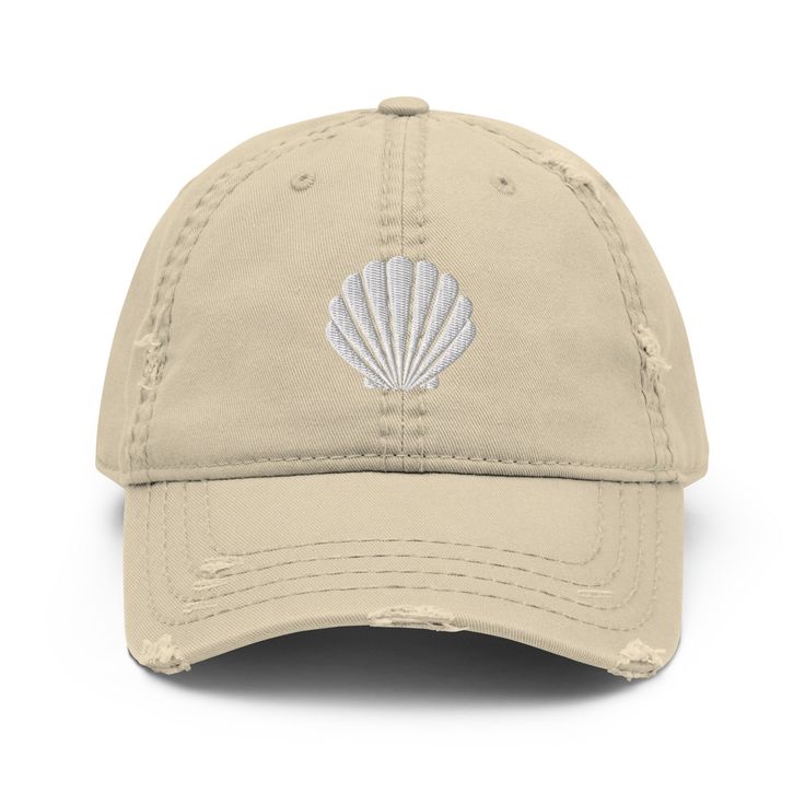 Seashell Embroidered Baseball hat with a slightly distressed brim and crown fabric, it'll add just the right amount of edge to your look. Perfect to wear at the beach! * 100% pre-shrunk cotton twill * Soft crown * 6 sewn eyelets * 6 stitched rows on the brim * 6-panel unstructured cap with a low profile * Seamed front panel without buckram * Adjustable hook and loop closure Adjustable Cotton Dad Hat For Beach, Cotton Brimmed Dad Hat For Beach, Cotton Beach Baseball Cap, Vintage Cotton Baseball Cap For Summer, Summer Brimmed Cotton Trucker Hat, Cotton Brimmed Trucker Hat For Summer, Summer Cotton Brimmed Trucker Hat, Summer Vintage Dad Hat With Curved Bill, Vintage Summer Dad Hat With Curved Bill