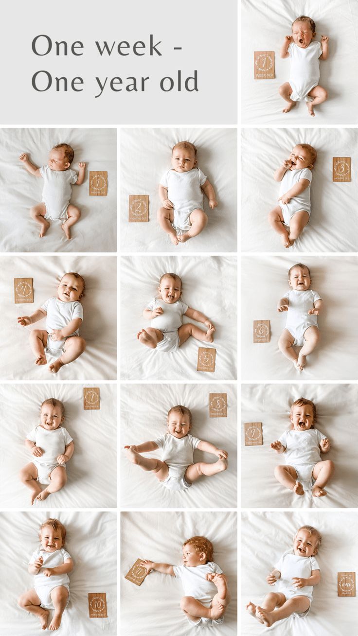 a baby is laying down on a white sheet and posing for the camera with his hands in