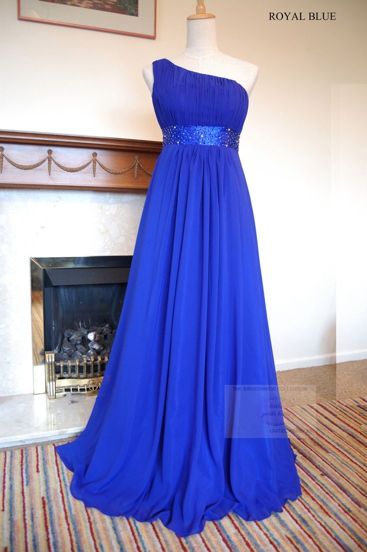 a blue dress on display in front of a fire place with the price tag $ 3