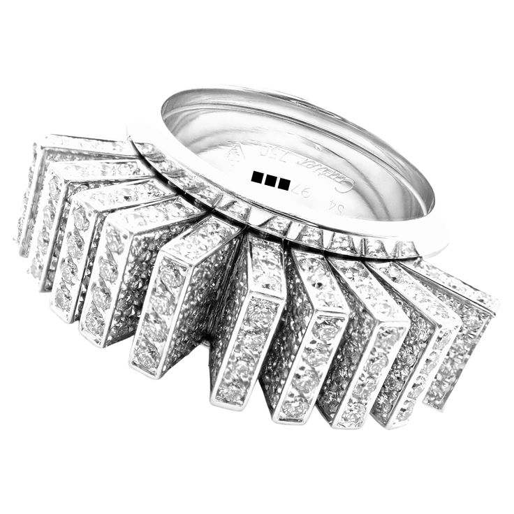 18k White Gold Diamond Fan Ring by Cartier. With 340 Round brilliant cut diamonds VVS1 clarity, E color total weight approximately 4.25ct This ring comes with original Cartier box and Cartier valuation report dated May 2018. Details: Ring Size: European 54, US 6 1/2 Weight: 26.1 grams Width: 11mm Stamped Hallmarks: Cartier 750 54 971XXX(serial number omitted) French Hallmarks **Free Shipping within the United States** YOUR PRICE: $25,000 T3002mhtdd Luxury Cartier Diamond White Rings, Luxury Evening Rings With Baguette Diamonds, Luxury Cartier Diamond Ring With Vvs Clarity, White Gold Baguette Diamond Rings For Evening, White Gold Rings With Baguette Diamonds For Evening, Cartier Luxury Diamond White Diamond Ring, Cartier Diamond White Brilliant Cut Diamond Ring, Luxury Cartier White Gold Diamond Ring, Cartier Luxury Diamond Ring With Prong Setting