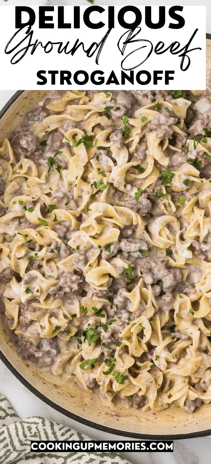 a large skillet filled with beef stroganoni and sauce