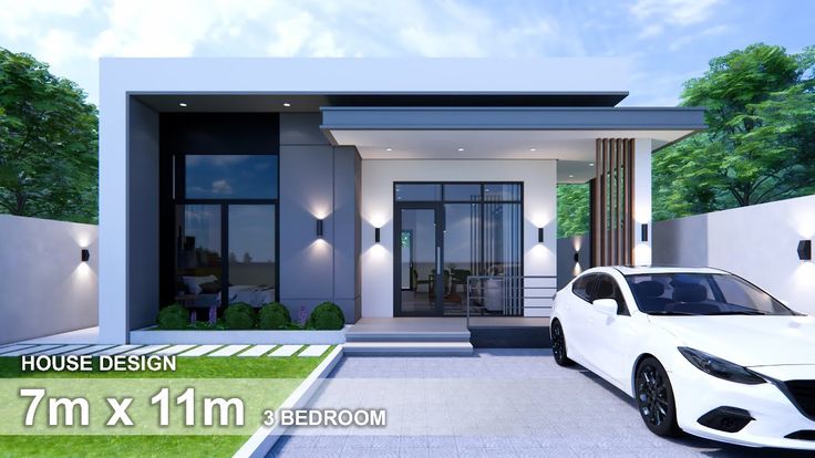 a white car is parked in front of a modern style house with glass doors and windows