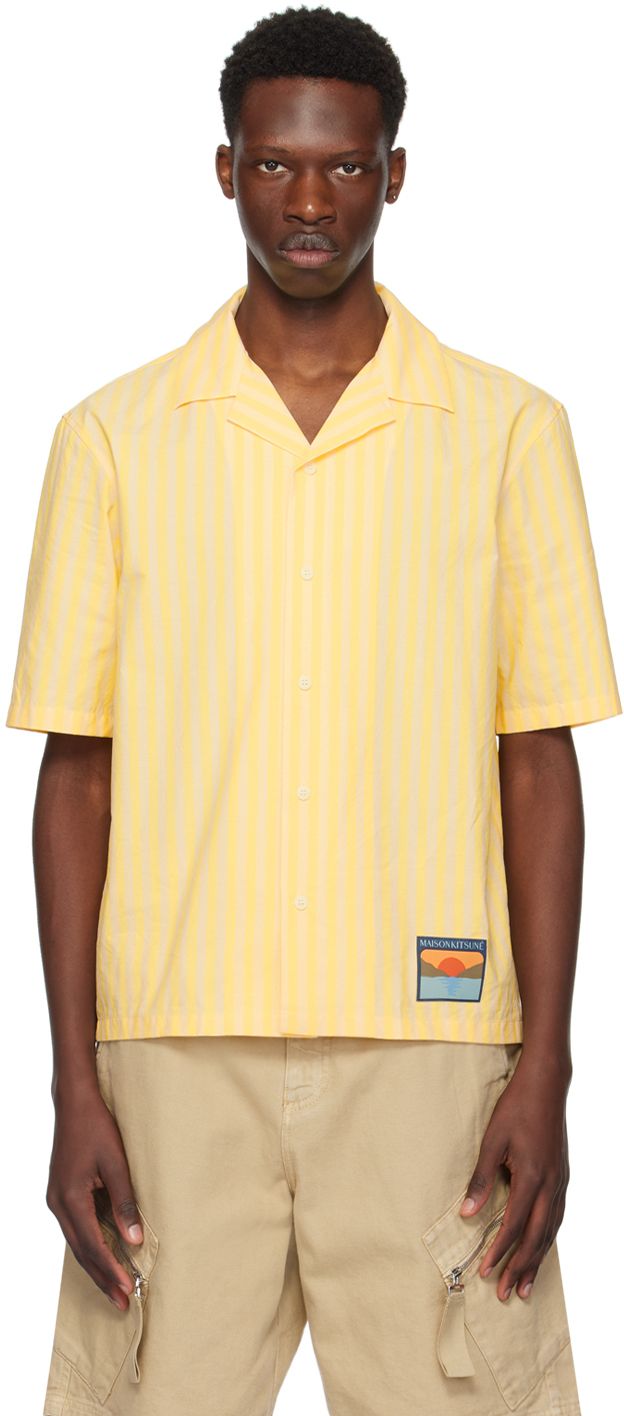 Boxy-fit cotton poplin shirt. Stripes throughout. · Open spread collar · Button closure · Logo patch at front hem Supplier color: Light yellow Yellow Relaxed Fit Collared Camp Shirt, Yellow Cotton Camp Shirt With Relaxed Fit, Resort Shirt, Cotton Poplin Shirt, Poplin Shirt, Light Yellow, Cotton Poplin, Apparel Accessories, Patch Logo