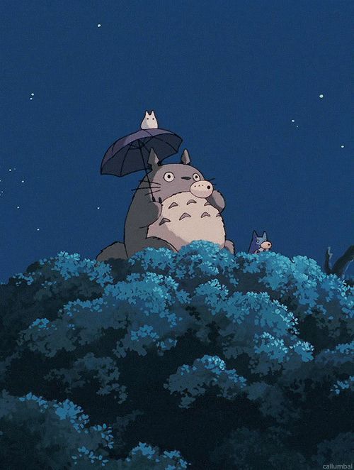 an animated image of a totoro holding an umbrella