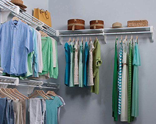 an organized closet with clothes hanging on rails and baskets in the bins next to it