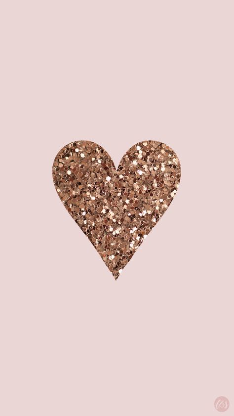 a heart made out of glitter on a pink background