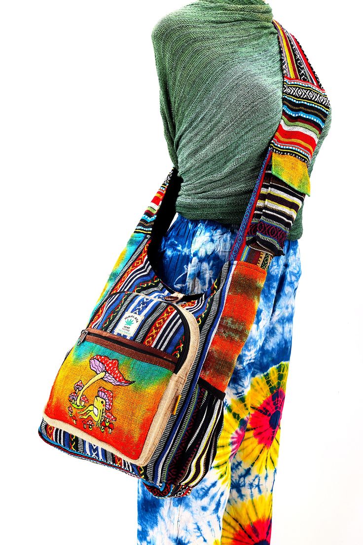 a woman carrying a multicolored handbag on her hippie style skirt, back view