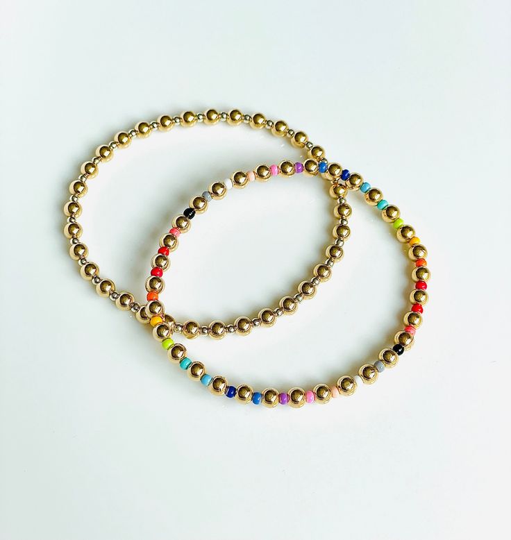 "\"One is silver and the other gold,\" - That is what came to my mind when making these bracelets! These luxe friendship bracelets are made with alternating 14K gold filled and sterling silver 4mm and 2mm beads. The best of both worlds! Looks great with any silver or gold stack! * New Rainbow friendship bracelets available now too! I love jewelry that is personal and tells a story. Let me know how I can personalize pieces for you! - need a special size you don't see? Message me and I will be hap Gold Hand-strung Friendship Bracelets As Gift, Gold Beaded Bracelet With Colorful 14k Gold Filled Beads, 14k Gold-filled Beaded Bracelets With Colorful Beads, Gold Friendship Bracelets With Colorful Beads As Gift, Friendship Bracelets With Colorful Beads As Gift, Gold Friendship Bracelets With Colorful Beads, Gold Jewelry With Colorful Beads For Everyday, Everyday Gold Jewelry With Colorful Beads, Yellow Gold Beaded Bracelet For Friendship