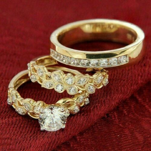 three gold wedding rings with diamonds on them