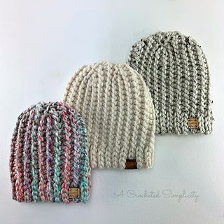 three knitted hats sitting on top of each other