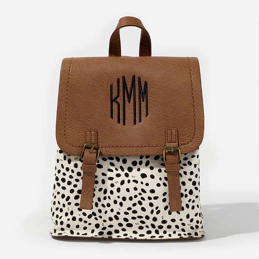 Keep up with all of your essentials with this convenient and cute Monogrammed Backpack Purse! Made of faux leather with front flap buckles, this backpack has two adjustable straps to fit comfortably. Check out our entire selection of monogrammed backpacks and monogrammed tote bags for more options!Made of Faux Leather​ with Brushed Polyester liningMeasures 11 by 9 by 4.75 inchesIncludes an inner top zip, interior zipper pocket and two open pocketsPlease note buckles are decorative Dro School Backpack With Adjustable Straps In Faux Leather, School Backpack With Adjustable Strap And Faux Leather, Casual Leather Crossbody Backpack For School, White Bags With Buckle Closure For Everyday Use, Faux Leather Backpack With Adjustable Strap, School Leather Backpack With Flap And Adjustable Strap, Cute Adjustable Backpack For Everyday Use, Everyday Backpack With Buckle Closure, Cute Leather Backpack With Adjustable Strap