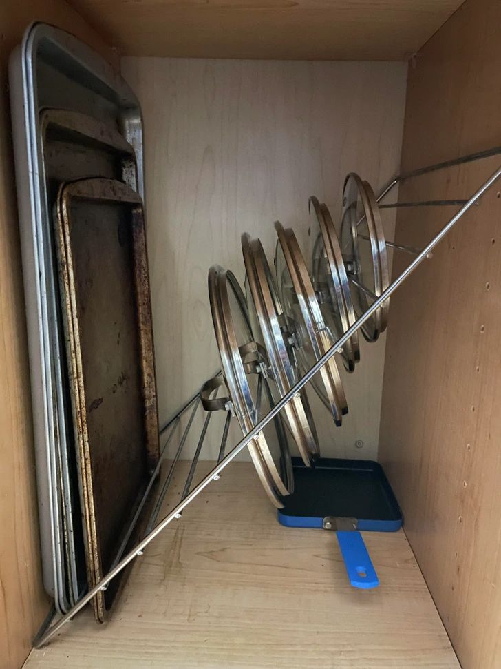 there are many metal objects in the cupboard