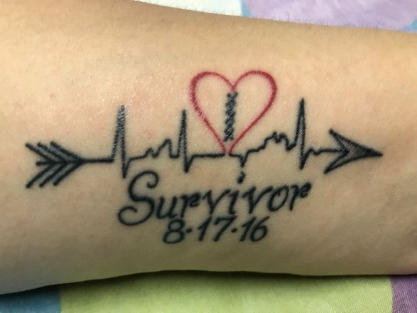 a tattoo with the words survivor and an arrow