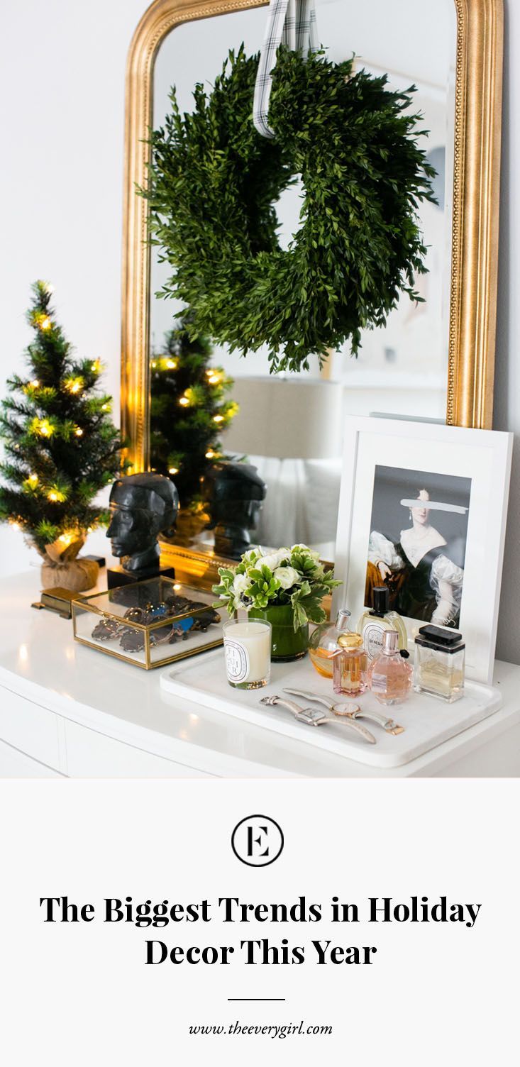 a white dresser with christmas decorations on it and the words, the biggest trend in holiday decor this year