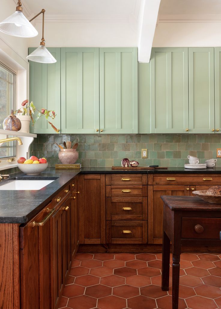 a kitchen with wooden cabinets and tile flooring