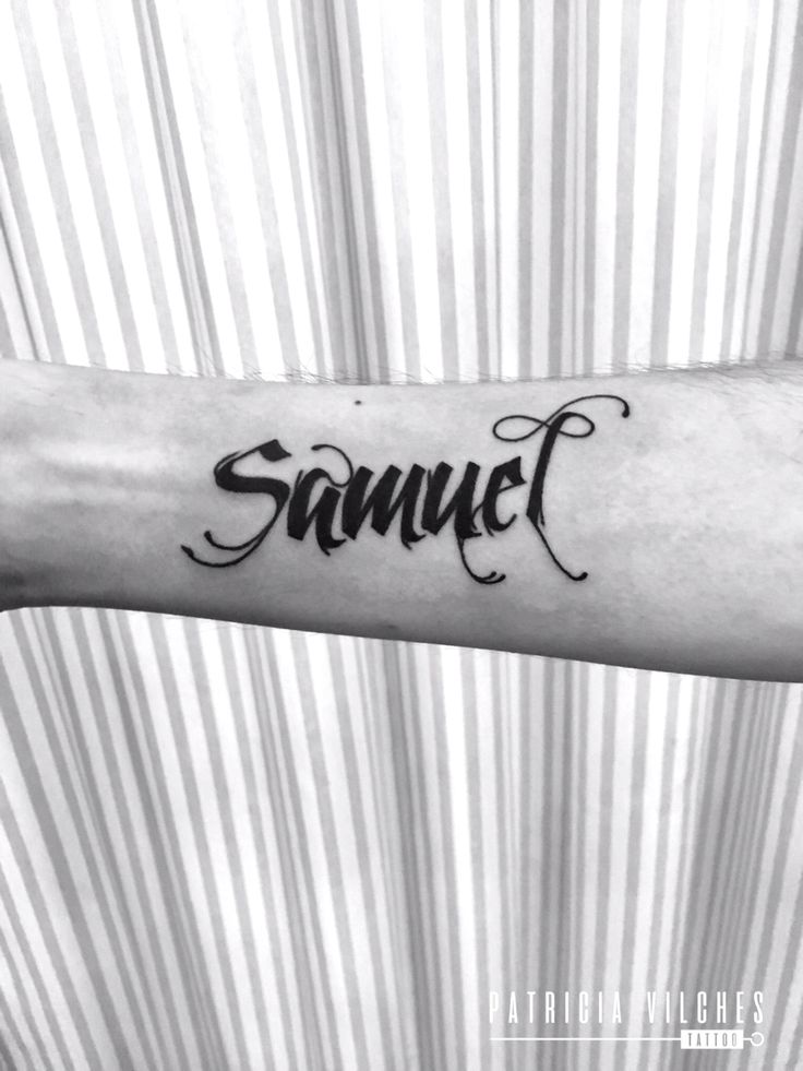 a black and white photo of a person's arm with the word samuel on it