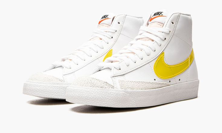 The Nike Blazer Mid ‘77 “Translucent Yellow Swoosh” is a colorway of the lifestyle shoe that modifies its 1970’s-era styling with a modified Swoosh.  The Blazer Mid ‘77 Vintage is based on an era-specific version of the old school basketball shoe and, here, features a translucent yellow Swoosh on the sides of its white leather upper.  Both the toe and the forefoot are complemented by grey suede panels.  A retro “Nike” logo appears on the tongue and old school “Nike” branding is found on the heel Nike Blazer Mid 77 Infinite, Nike Blazer 77 Vintage, Blazer 77, Blazer Mid 77 Vintage, Yellow Nikes, Nike Blazer Mid 77, Nike Blazer Mid, Nike Blazers Mid, Nike Brand