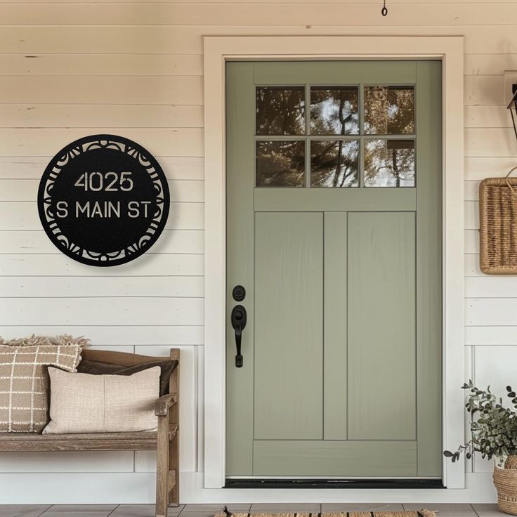 the front door to a house with a sign on it that reads, 4202 main st