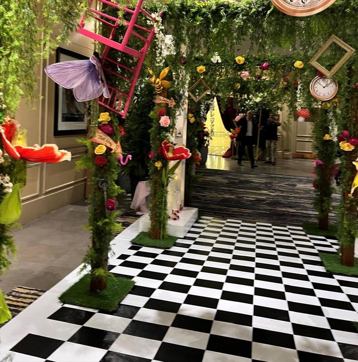 a checkered floor is decorated with flowers and decorations