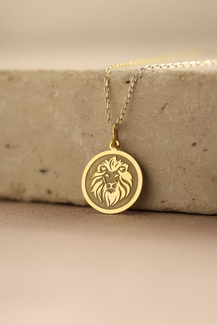 Gold Lion Pendant - Lion Head Gold Necklace ● Material of pendant: Solid Gold 14k ( REAL GOLD ) ● Metal Stamp: 14k ( REAL GOLD ) ● The pendant is available in 5 sizes: - 12,7 mm / 0.5 inches (Diameter) - 14,0 mm / 0,55 inches ( Diameter ) In the photos - 15,3 mm / 0.6 inches ( Diameter ) - 16,5 mm / 0,65 inches ( Diameter ) - 19,1 mm / 0,75 inches ( Diameter ) ( In the photos the size is 14mm / 0.55 inches Diameter ) ( Jump Ring inner diameter: 4 mm ) ● Material of chain: Solid gold 14k ( REAL G 14k Gold Medallion Necklace Amulet Style As A Gift, 14k Gold Amulet Medallion Necklace As A Gift, Gold Medallion Sterling Silver Custom Necklace, Gold Coin Jewelry For Anniversary, Gold Sterling Silver Custom Necklace With Charms, 14k Gold Pendant Medallion Necklace As Gift, Yellow Gold Coin Charm Necklace As Gift, Yellow Gold Coin Charm Necklaces For Gifts, Yellow Gold Coin Charm Necklace