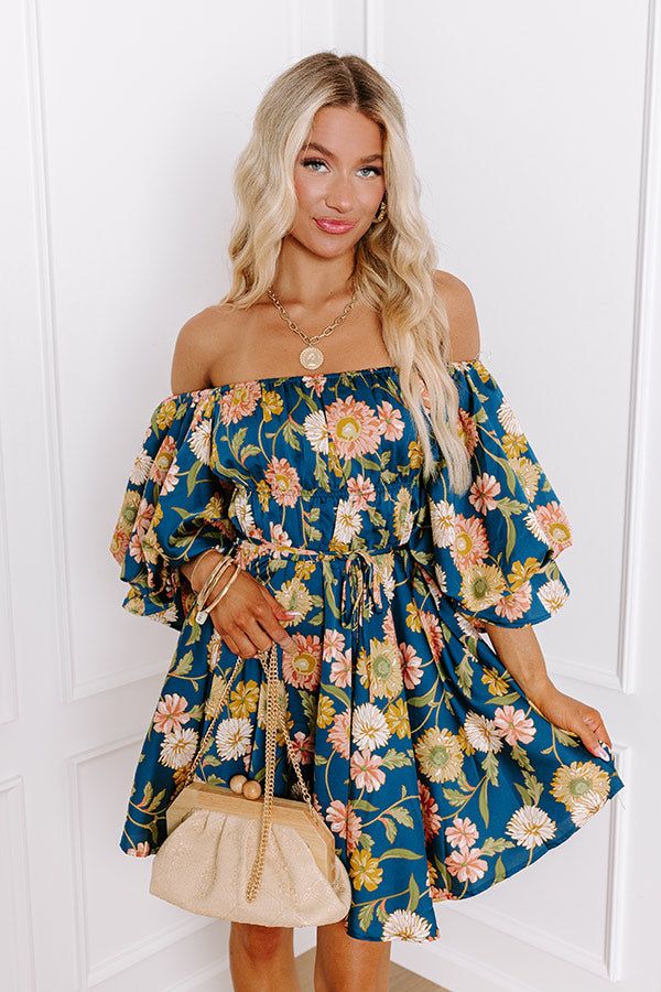 - Let your style blossom this season in this gorgeous dress! - Fully lined material with a pink, yellow, and ivory hued floral print and a satin finish - An elastic scoop neckline that can be worn off shoulder - A double banded elastic waistline with a tie detail for additional waist cinching - A side zip closure bodice - Puffy half sleeves with elastic ruffle cuffs - A flowy yet flattering silhouette that ends in a mini dress length hemline Measurements S : Bust 32", Hip 38", Length 27", Sleeve Floral Print Off Shoulder Mini Dress For Brunch, Off Shoulder Mini Dress With Floral Print For Brunch, Floral Print Off-shoulder Mini Dress For Brunch, Floral Print Off-shoulder Mini Dress For Garden Party, Floral Print Mini Dress With Straight Neckline For Brunch, Spring Floral Print Off Shoulder Dress For Garden Party, Spring Floral Print Off-shoulder Midi Dress, Floral Print Off-shoulder Dress For Garden Party, Flowy Floral Print Off Shoulder Dress For Brunch