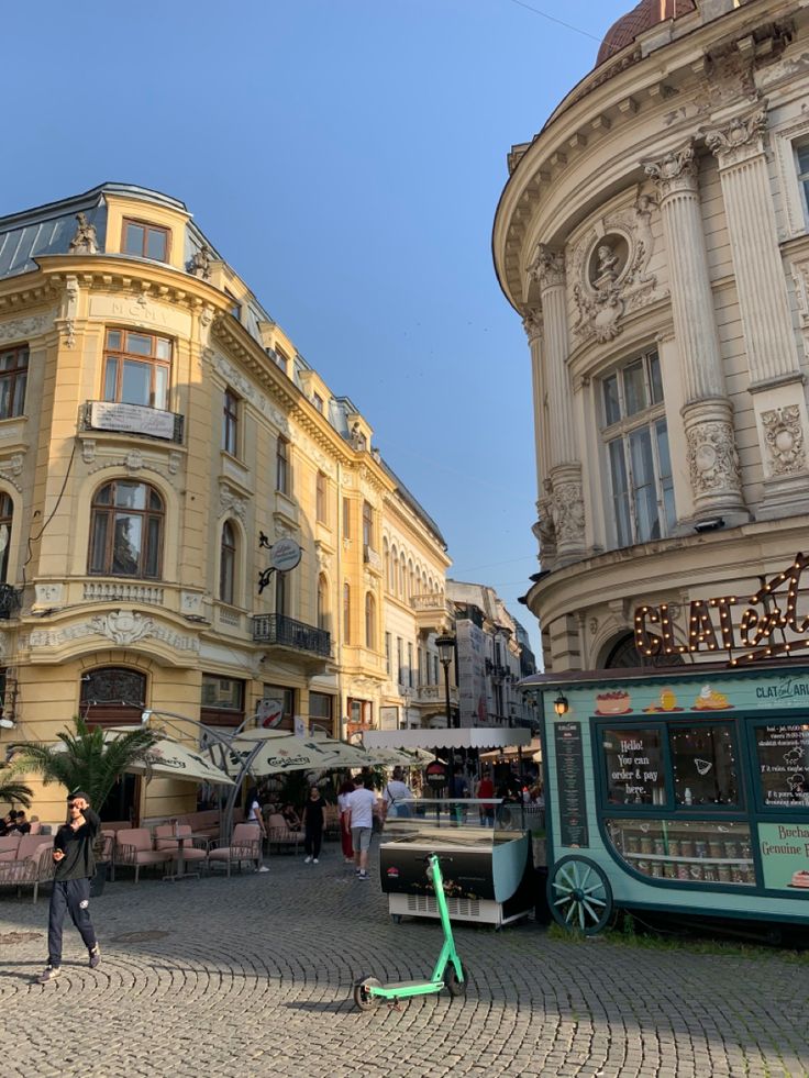 people are walking around in an old european town