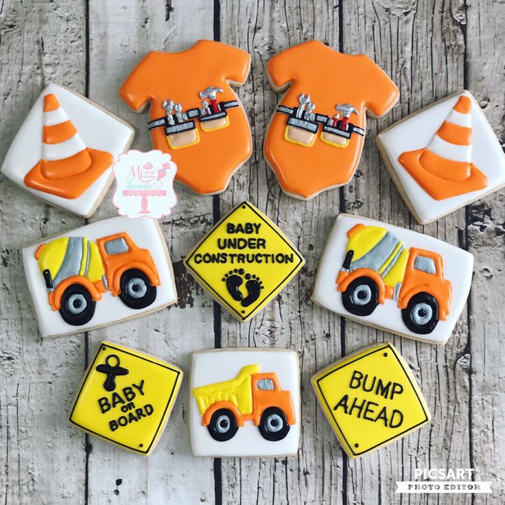 decorated cookies in the shape of construction vehicles