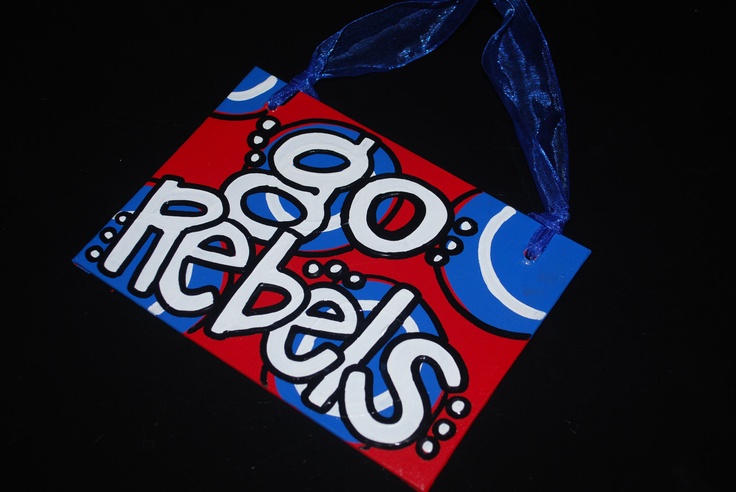 a red bag with the word boo's on it is hanging from a blue ribbon