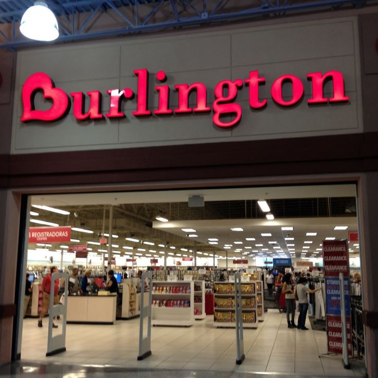 the entrance to a store with people walking in front of it and there is a sign that says, burlington