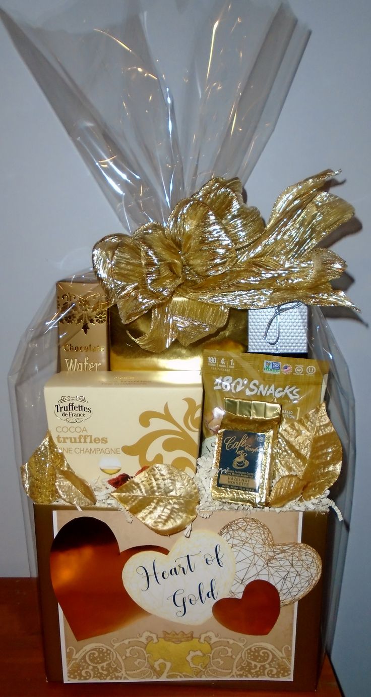 a gift box filled with gold and chocolates