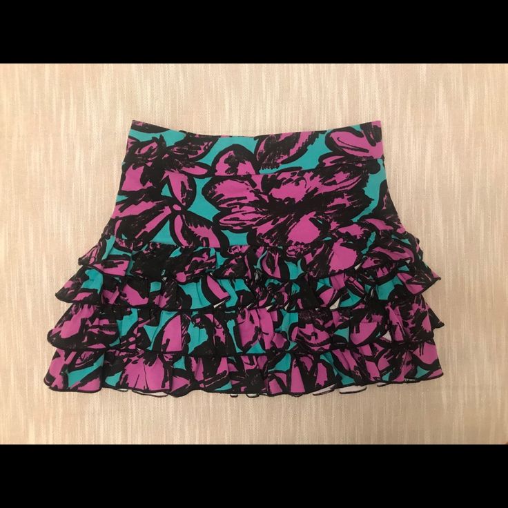 Never Worn, Cotton Ruffle Skirt With Light Purple And Teal Pattern. Fitted Multicolor Ruffled Mini Skirt, Fitted Purple Skirt With Ruffles, Party Purple Ruffled Mini Skirt, Fitted Green Skort With Ruffles, Party Mini Skirt With Ruffles In Purple, Fitted Multicolor Tiered Mini Skirt, Purple Ruffled Skirt For Party, Elegant Multicolor Mini Skirt For Summer, Purple Ruffled Mini Skirt For Party