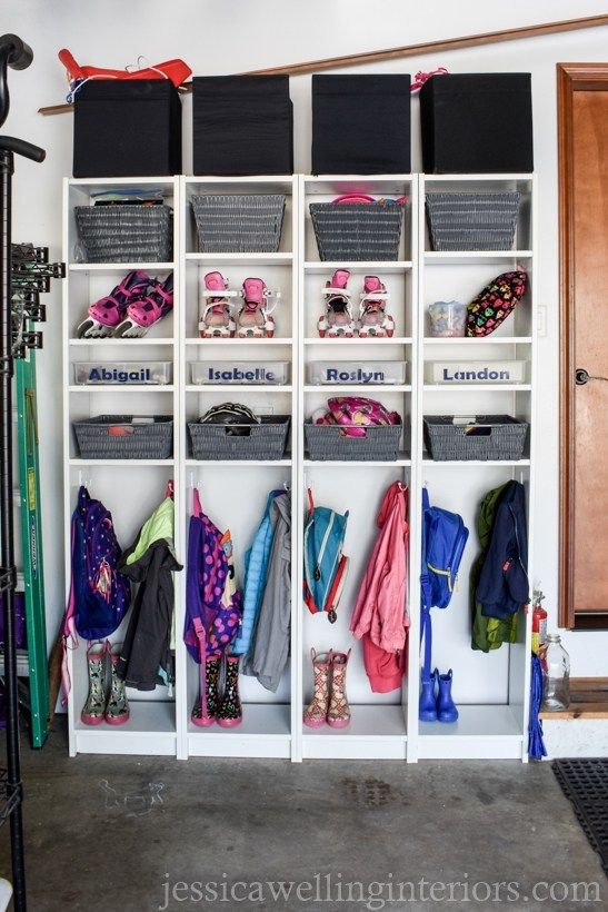 a white closet filled with lots of clothes