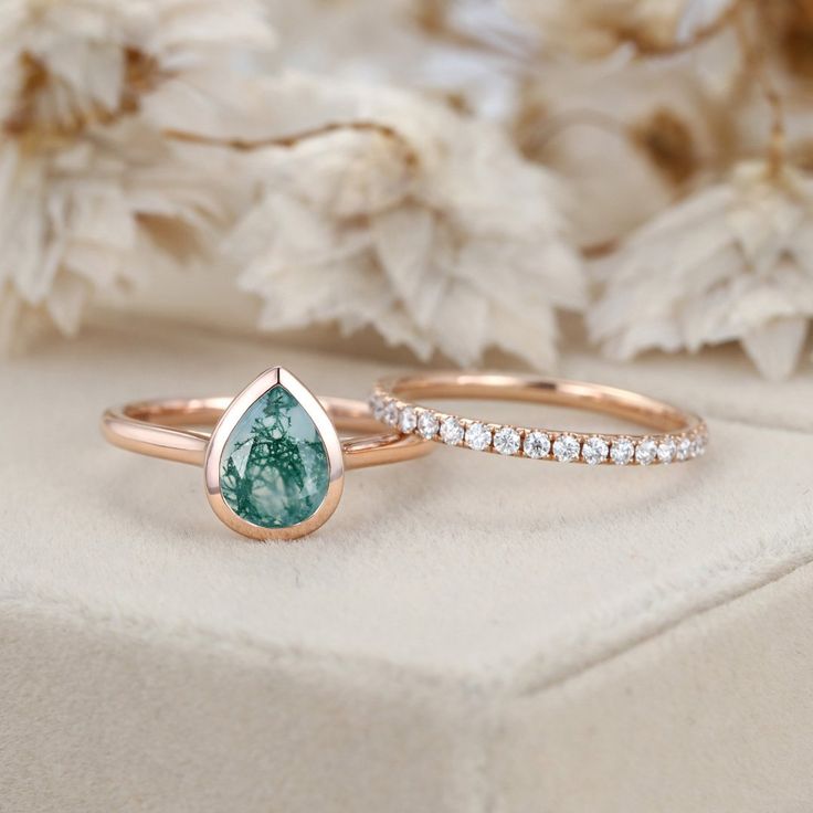 Experience timeless elegance with our Pear Shape Bezel Moss Agate Engagement Ring Set in 14K rose gold, a perfect choice for weddings, promises, and anniversaries. Gold Moss Agate Engagement Ring, Turquoise Engagement Ring, Turquoise Ring Engagement, 14k Rose Gold Wedding Ring, Moss Agate Engagement Ring, Agate Engagement Ring, Pear Shaped Engagement Rings, Moissanite Diamond Rings, Wedding Rings Rose Gold