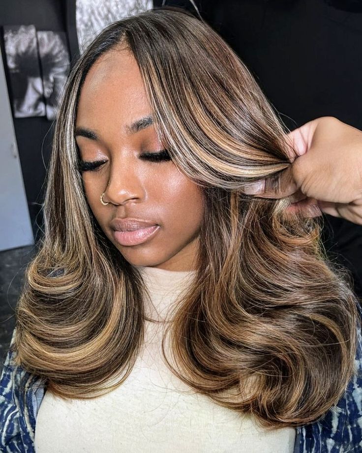 Hair Color Ideas For African Black Women, Brown Hair With Highlights Sew In, Middle Part Sew In Highlights, Bayalage Blonde Black Women, Highlights On Natural Brown Hair, Dark Brown Hair With Blonde Skunk Stripe, Black With Honey Blonde Highlights, Side Part Brown Hair With Highlights, Blonde Highlights Brown Hair Black Women