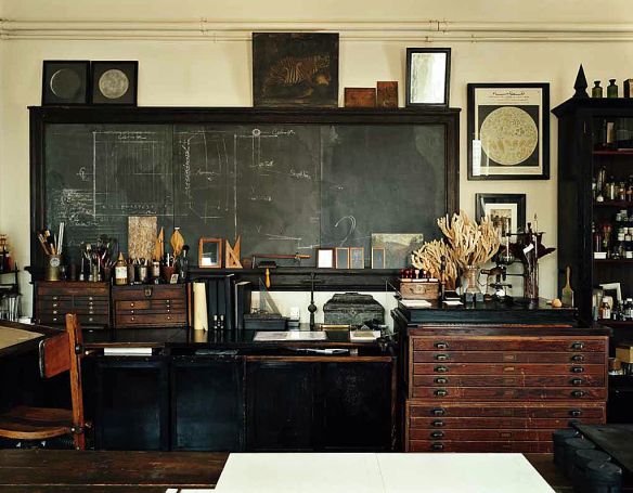 an old fashioned blackboard in the corner of a room