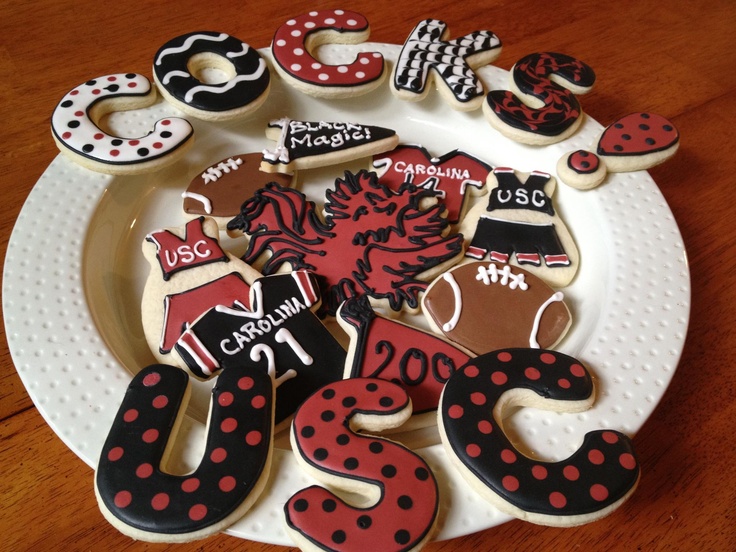 decorated cookies are arranged on a plate with the numbers twenty five and thirty six in them