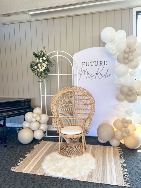 a room with balloons, chairs and a sign that says future mrs kohle