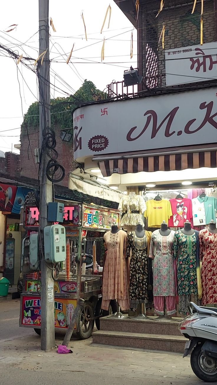 a store with clothes on display in front of it