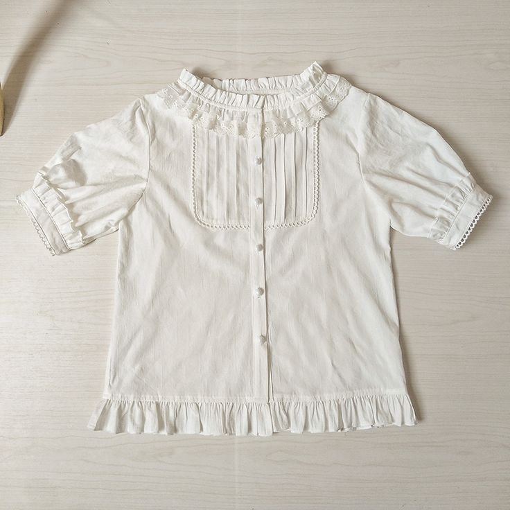 Features: It features ruffled stand collar, short sleeves, placket with five buttons, flounce hem.Attention: This price includes a shirt only, others are not included. Size Chart:Size (CM): Unit CM; Sizes below are measured in flat-laid position, hand measurement will have discrepancy of about 2 CM.Size(cm)XSSMLXLXXLShoulders353637383940Bust8286909498102Short / Long Sleeve Length26/5626/5626/5826/5826/6026/60Shirt Length555557575959 Casual Short Sleeve Blouse With Lace Collar, Casual Blouse With Lace Collar And Short Sleeves, Casual Blouse With Peter Pan Collar And Ruffles, Casual Tops With Doll Collar And Buttons, Solid Color Ruffled Short Sleeve Tops, Cotton Top With Doll Collar And Buttons, Cotton Top With Doll Collar And Ruffles, Cotton Doll Collar Top With Buttons, Cotton Blouse With Ruffles And Doll Collar