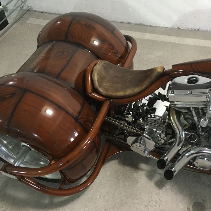 the motorcycle is made out of wood and metal