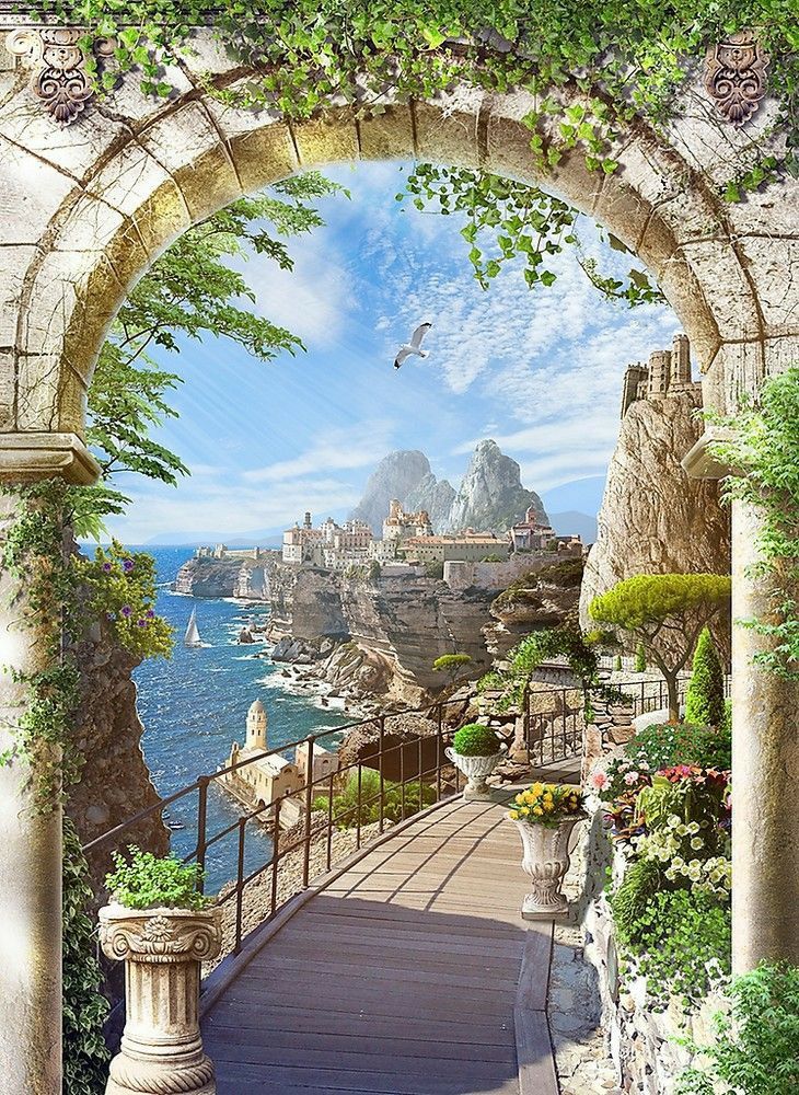 an archway leading to the ocean with plants and flowers on either side that leads to a beach