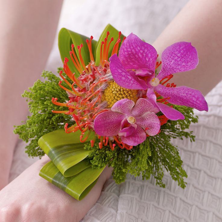 a woman holding a bouquet of flowers in her hands