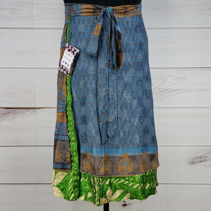 Nwt Darn Good Yarn Brand Recycled Sari Silk Wrap Skirt. Reclaimed Material From Used Saris. Tea Length (Approx. 29 In. Long). Dgy Size Xl/Plus (Us Size 8-20). Reclaimed Material Means Flaws (Stains, Holes, Ink Errors, Thread Pulls, Etc.) Are Common And Expected! I List What I See, But May Miss Some. Matte Beige Paint Accents On Overskirt. Weave Imperfection/Loose Threading On Overskirt. Wear + Multiple Thread Pulls Throughout Well-Loved Underskirt. Blue Fitted Wrap Skirt For Casual Wear, Blue Tiered Lined Wrap Skirt, Blue Lined Midi Wrap Skirt, Blue Relaxed Midi Wrap Skirt, Blue Relaxed Fit Midi Wrap Skirt, Relaxed Fit Blue Midi Wrap Skirt, Casual Blue Wrap Skirt, Casual Long Blue Wrap Skirt, Fitted Blue Cotton Wrap Skirt