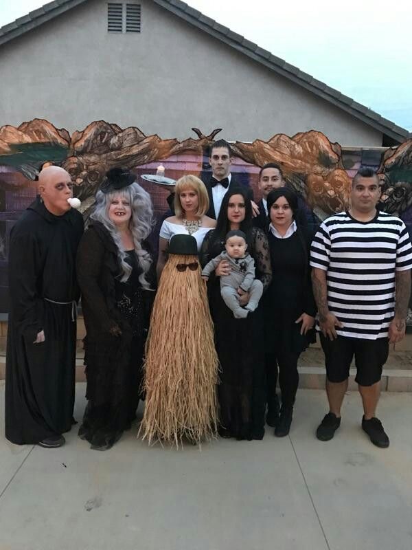 a group of people dressed up in halloween costumes