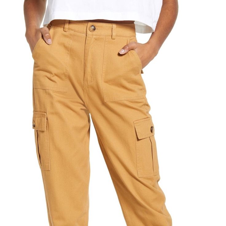 Know One Cares Drawstring Woven Cargo Pants In Mustard Relaxed Fit Yellow Pants With Pockets, Yellow Relaxed Fit Pants With Pockets, Spring Mustard Bottoms With Pockets, Mustard High-waisted Casual Pants, Yellow Cotton Bottoms With Side Pockets, Casual Yellow Pants With Pockets, Yellow Cotton Cargo Pants With Pockets, Yellow Cotton Cargo Pants, Yellow Cotton Pants With Cargo Pockets