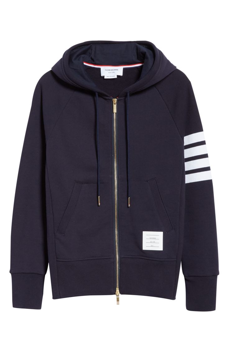 Engineered stripes at the left sleeve play up the sporty look of a cotton French terry hoodie featuring ribbed side panels for enhanced comfort and mobility. Tricolor aglets and a name tag at the hem are customary Thom Browne touches. Style Name:Thom Browne Classic 4-Bar Zip Cotton Hoodie. Style Number: 5155843. Available in stores. Navy Athleisure Sweatshirt With Ribbed Cuffs, Sporty Hoodie With Ribbed Cuffs, Navy Athleisure Hoodie With Double-lined Hood, Fall Sports Sweatshirt With Contrast Stripes, Navy Double-lined Hood Hoodie For Athleisure, Sporty Fall Sweatshirt With Three Stripes, Athleisure Sweatshirt With Three Stripes For Fall, Athleisure Three Stripes Sweatshirt For Fall, Sporty Cotton Hoodie With Three Stripes