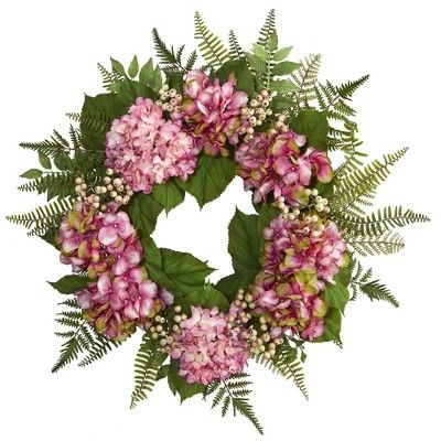 a wreath with pink flowers and green leaves